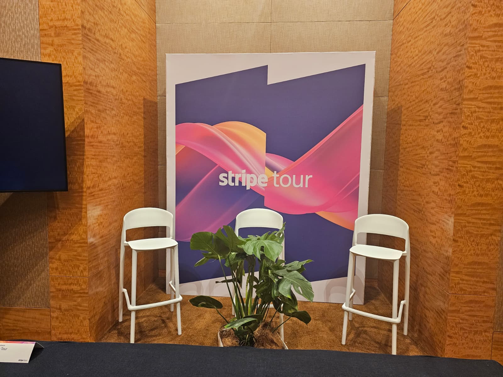 Stripe Tour branded event setup with minimalist stage seating and modern backdrop design